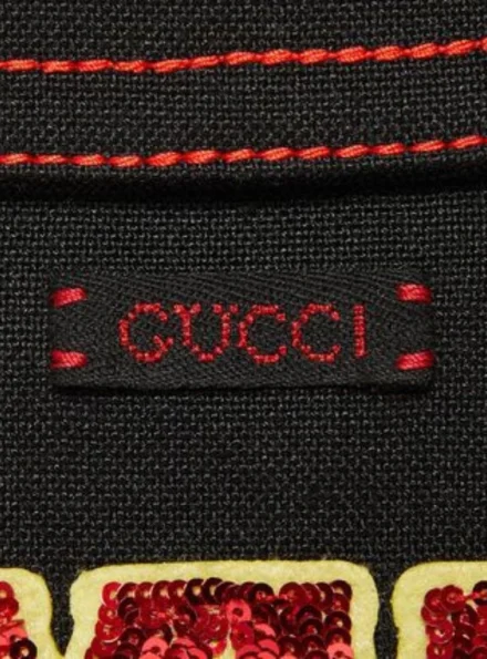 Jenna Ortega cropped Hollywood Babylon jacket Gucci emblem